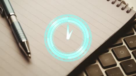 animation of clock ticking over notebook and laptop on wooden table