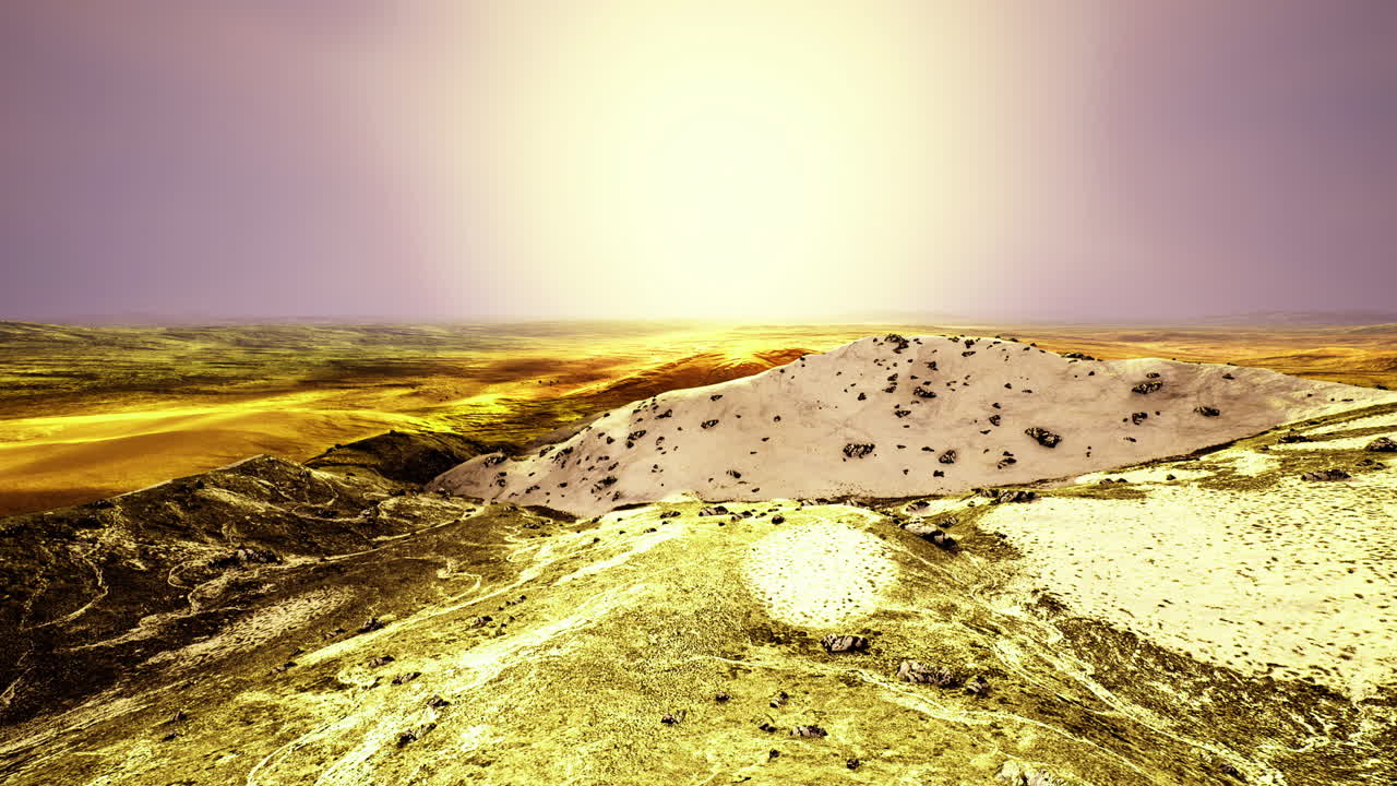 Desert landscape illuminated by a vivid sunset over rolling hills