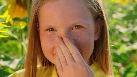 smiling girl in a sunflower field
