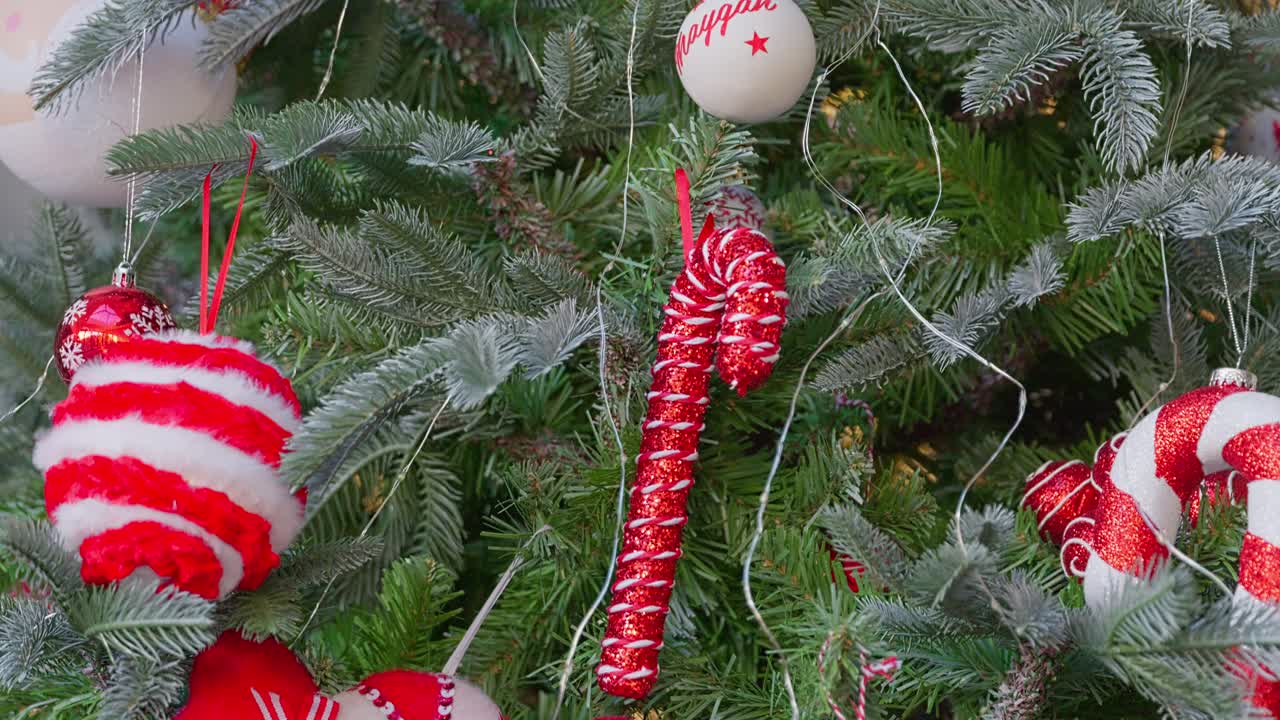 Christmas tree with fairy lights and trimmings. Decorations and balls with festive concept. Merry Christmas