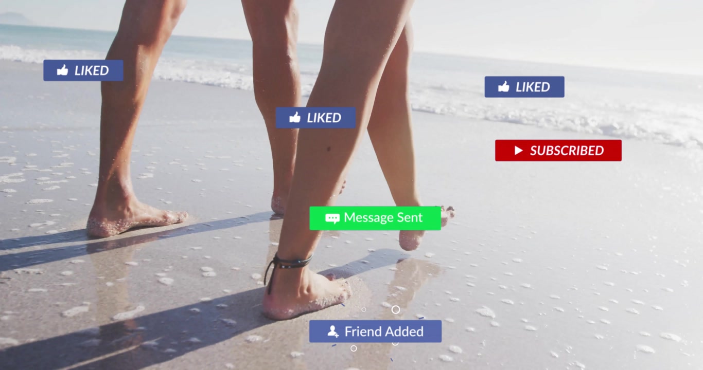 Couple walking along wet sand shore, bare feet initiating social media overlays showing engagement