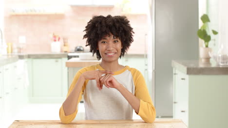 smiling woman in kitchen chatting with women friends during holiday gathering