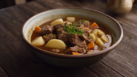 hearty beef stew with potatoes and carrots in a bowl