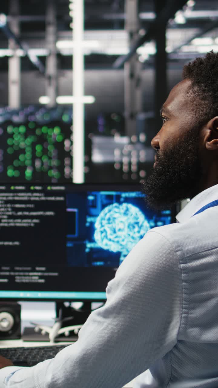 Vertical Video Data Center Supervisor Overseeing Work Done By Engineer Using Deep Learning