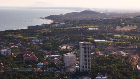 aerial establishing shot over the beach resort town of phan thiet, binh thuan province, vietnam