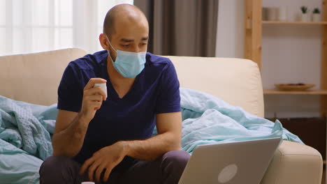 ill man at home talking online with his doctor