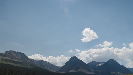 fast moving clouds above mountains, timelapse static