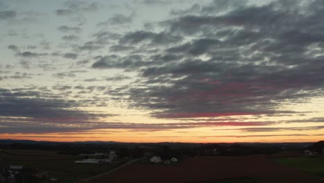 Rising-aerial-of-dramatic-sunrise,-sunset