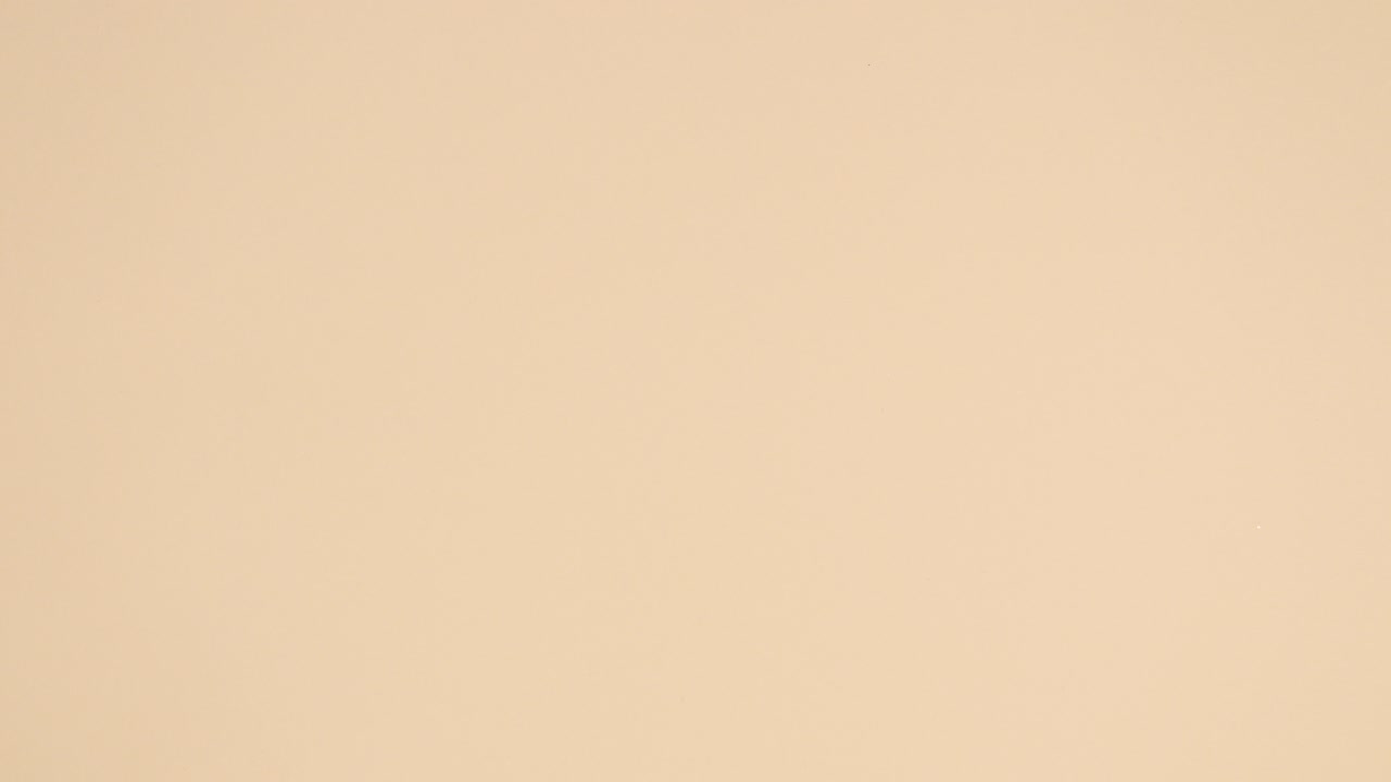 Tropic glamour gold palm leaf and golden copy space frame appear on nude background. Stop motion