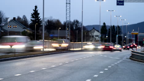 vehicles driving on road in evening in tromso, norway. timelapse