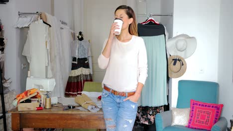 tailor with cup of coffee in parlour