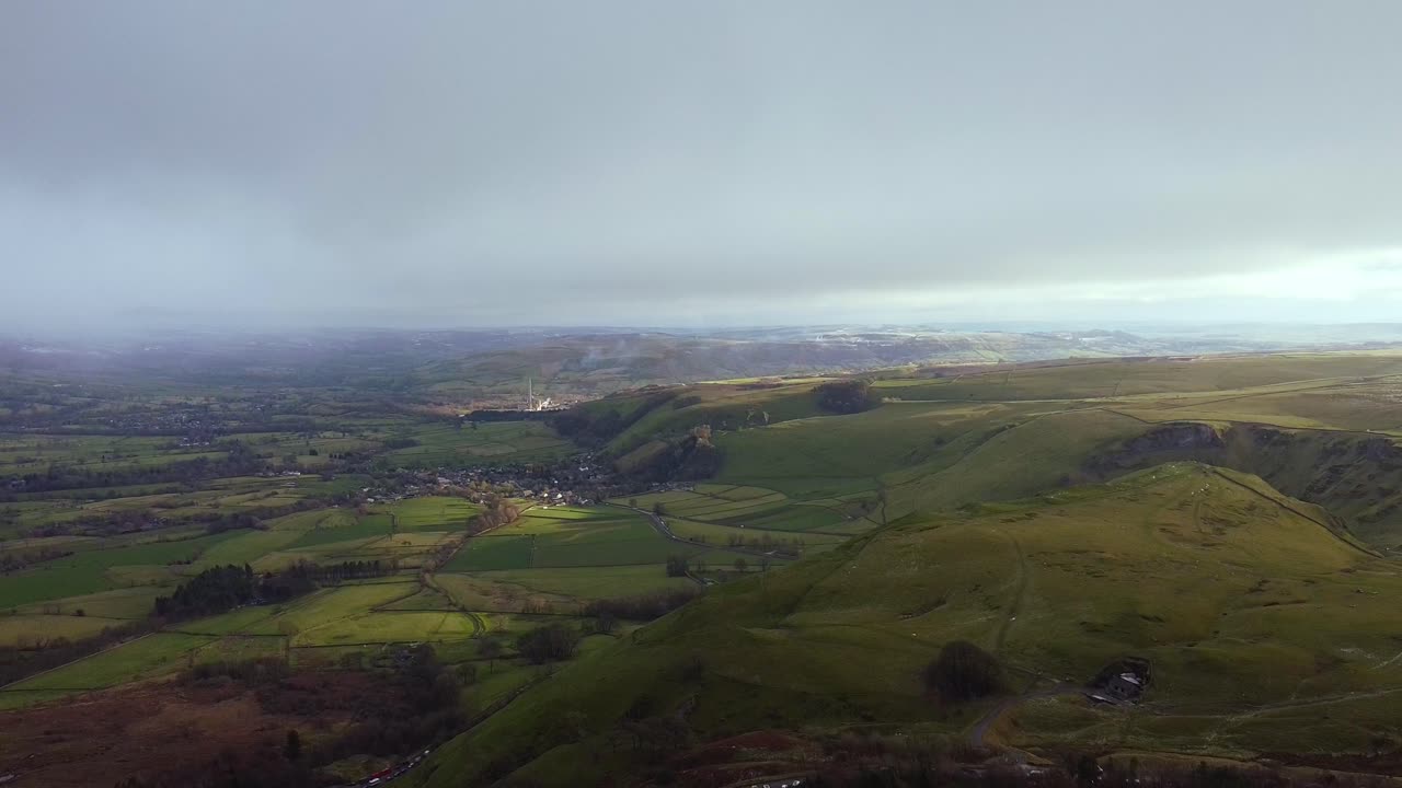 Aerial view Peak District, lush green fields and village 2