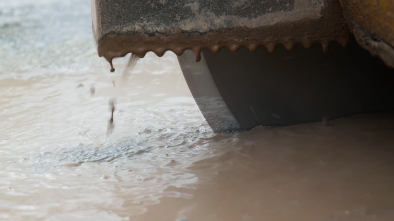 Close-up of a Concrete Cutting Saw in Action