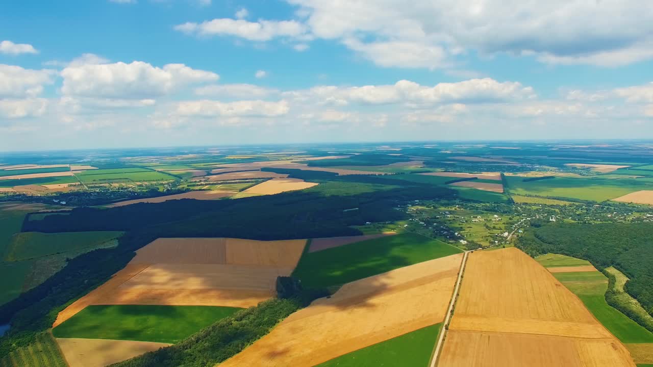 Beautiful landscape of green and yellow fields near river. Amazing view of nature with a blue river and fields. Harmful factory with pipes among nature. Aerial view.
