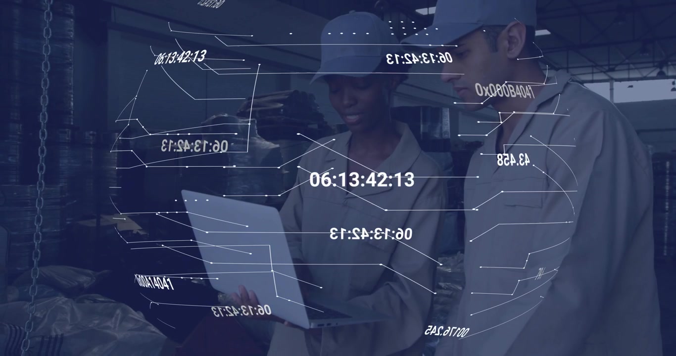 Two warehouse technicians unfolding laptop and navigating live data overlay for stock management