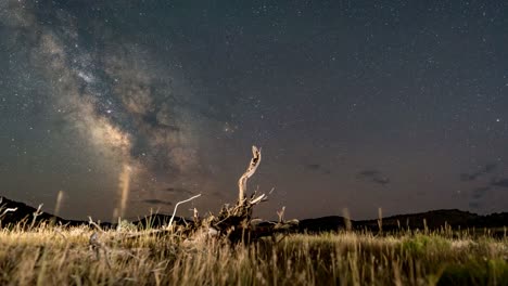 sunset to nighttime holy grail milky way core time lapse in the utah west desert along the pony express trail in summer with some wispy clouds drifting by