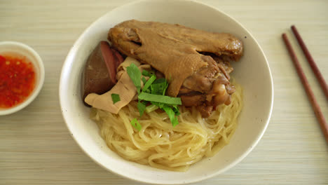 dried-noodles-with-braised-duck-in-white-bowl---Asian-food-style