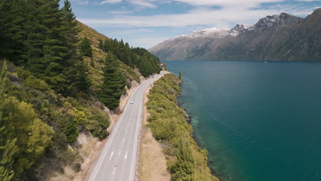 scenic road trip along a lake in new zealand