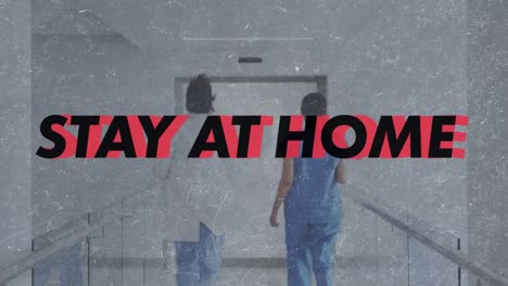 animation of stay at home text over doctors running in hospital