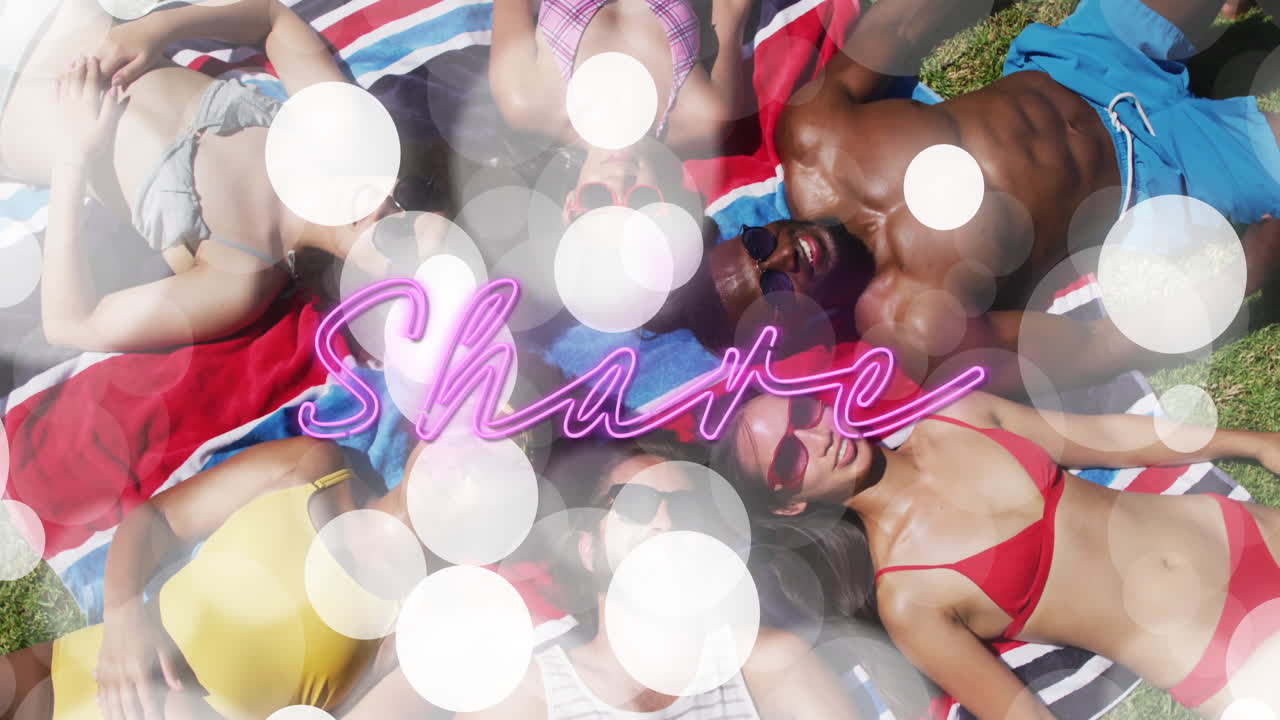 group of friends sunbathing on striped towel in park, showing neon Share graphic for marketing