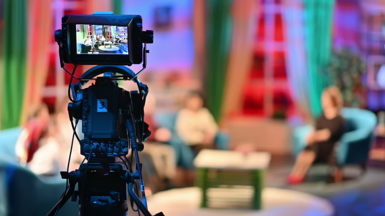 Professional television camera shooting a talk show in a studio. Video production backstage