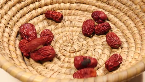 falling fresh jujube on wood basket