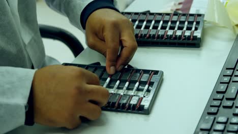 laboratory technician arranging blood samples in a rack 4k