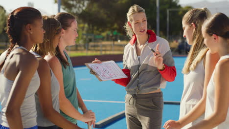 Hockey-coach-planning-a-strategy-with-a-group