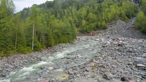 Drone-View-of-Forest-and-River-Scene-in-Spruga,-Locarno-Mountains-in-Switzerland-Alps