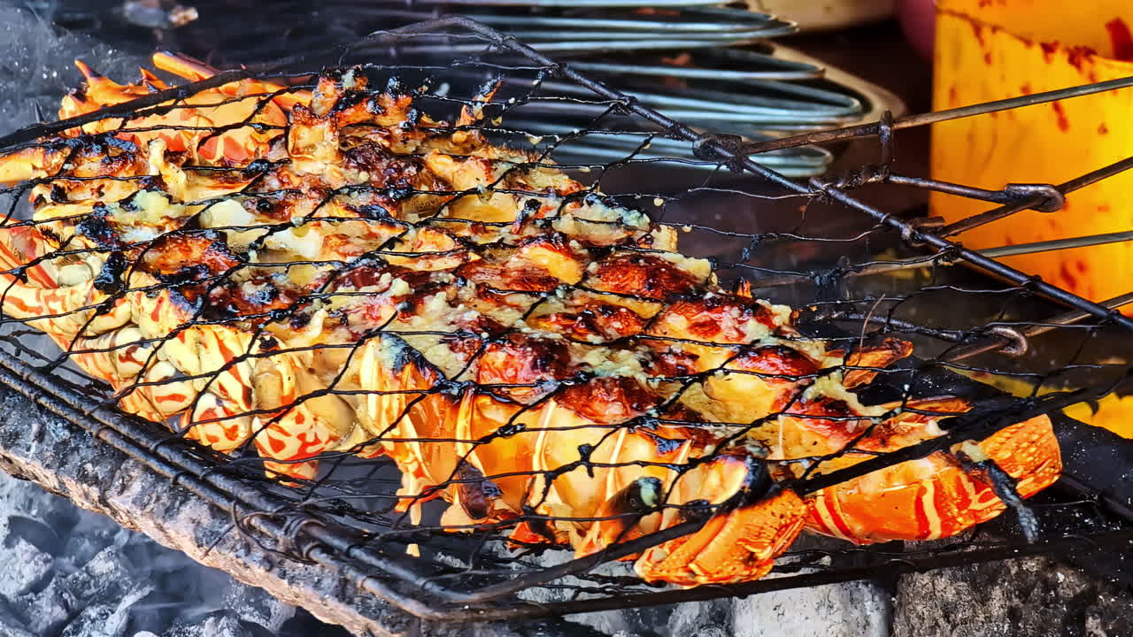 Fresh seafood grilling over smoky BBQ at Kedonganan Fish Market, filled with rich aromas.
