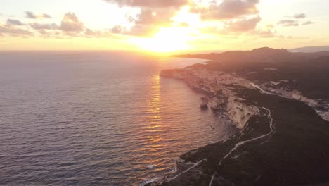 incredible aerial shot of bonifacio town in corsica, aerial view at sunset