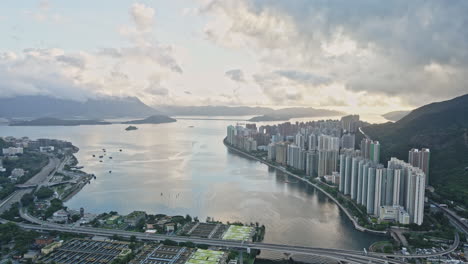 sunrise aerial view of ma on shan in shatin with dramatic sky, hong kong