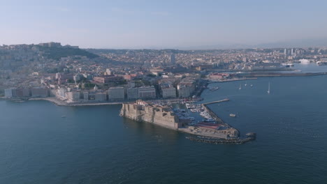 Rotating-aerial-footage-of-Castel-Dell'Ovo-in-Naples,-Italy