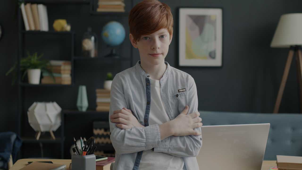 Teenage Boy Posing at a Desk