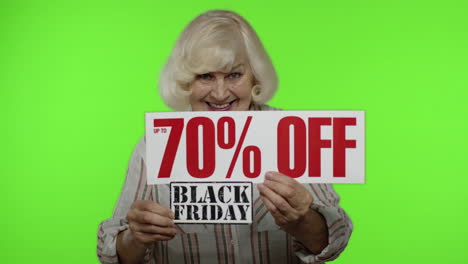 Grandmother-showing-Black-Friday-and-Up-To-70-Percent-Off-shopping-price-discount-advertisement