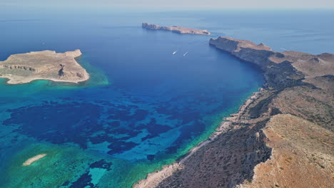 aerial view of rocky coastline and clear waters in a coastal area