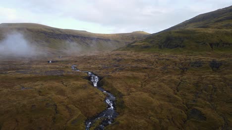 drone footage of cliffs with waterfalls near the saksun village on the streymoy island in the faroe islands