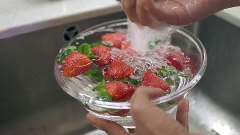 washing strawberries