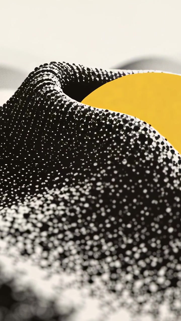 Vertical video: Revealing yellow disk by trough, particle field shifting and hiding disk in studio
