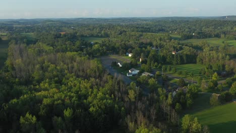 drone-flight-over-the-sacred-grove-near-the-Joseph-Smith-family-farm,-frame-house,-temple,-visitors-center-in-Palmyra-New-York-Origin-locations-for-the-Mormons-and-the-book-of-Mormon