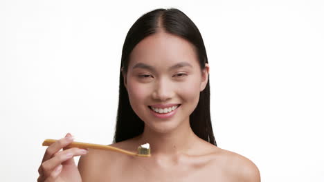 smiling woman with toothbrush