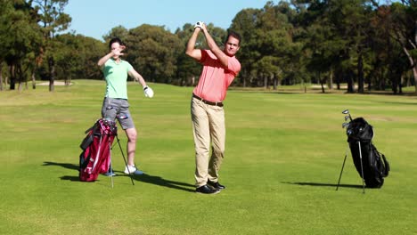 two golfer players playing golf together