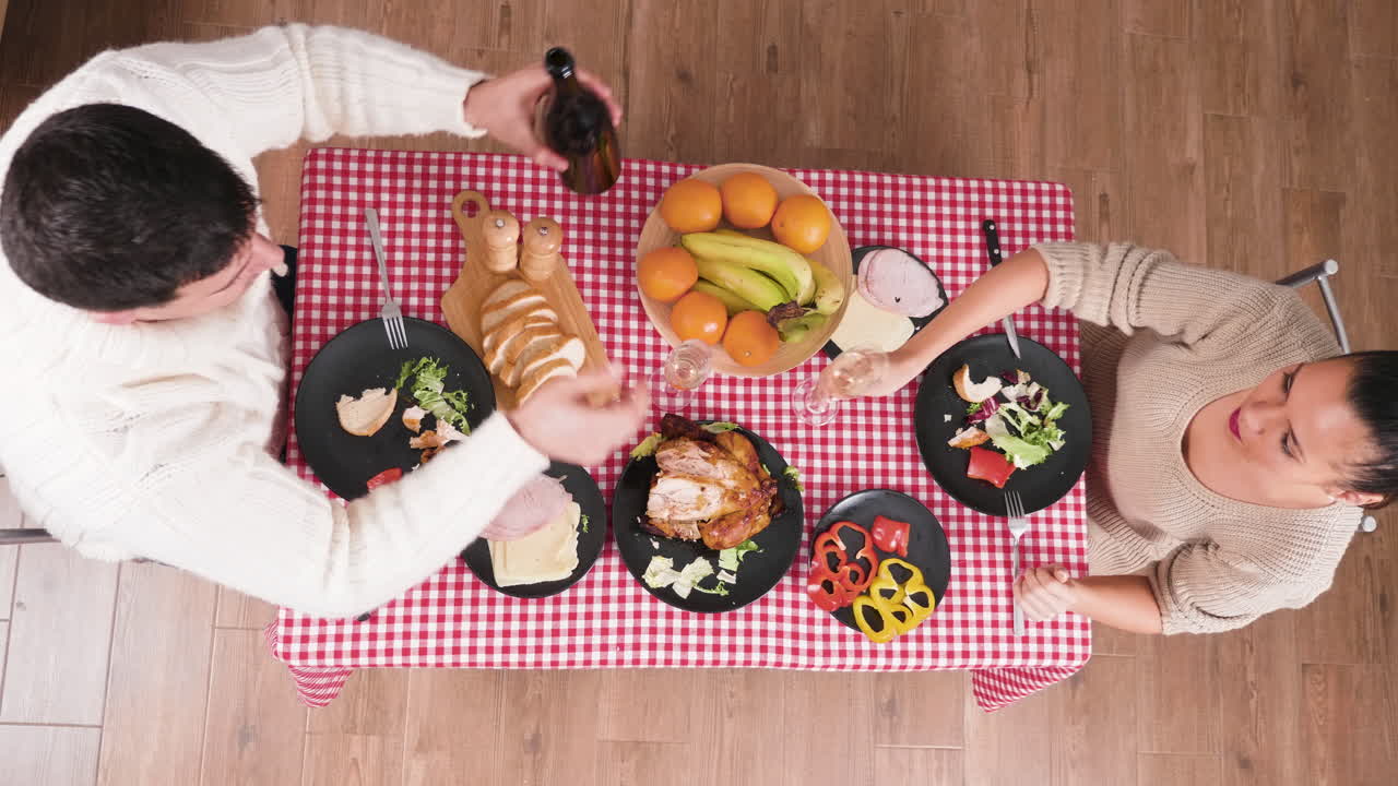 Overhead Shot of People Dining at a Table with Food
