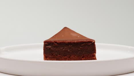 chocolate cheesecake slice on white plate