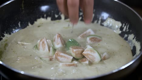 Adding-Fresh-Green-Thai-Eggplant-into-Boiling-Green-Curry