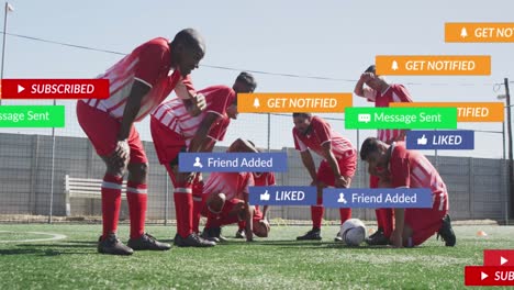 social media concept icons against team of diverse tired male soccer players on sports field