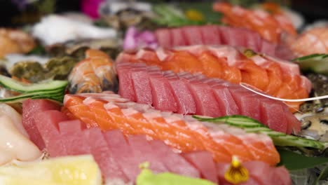 assorted fresh sushi and sashimi on display