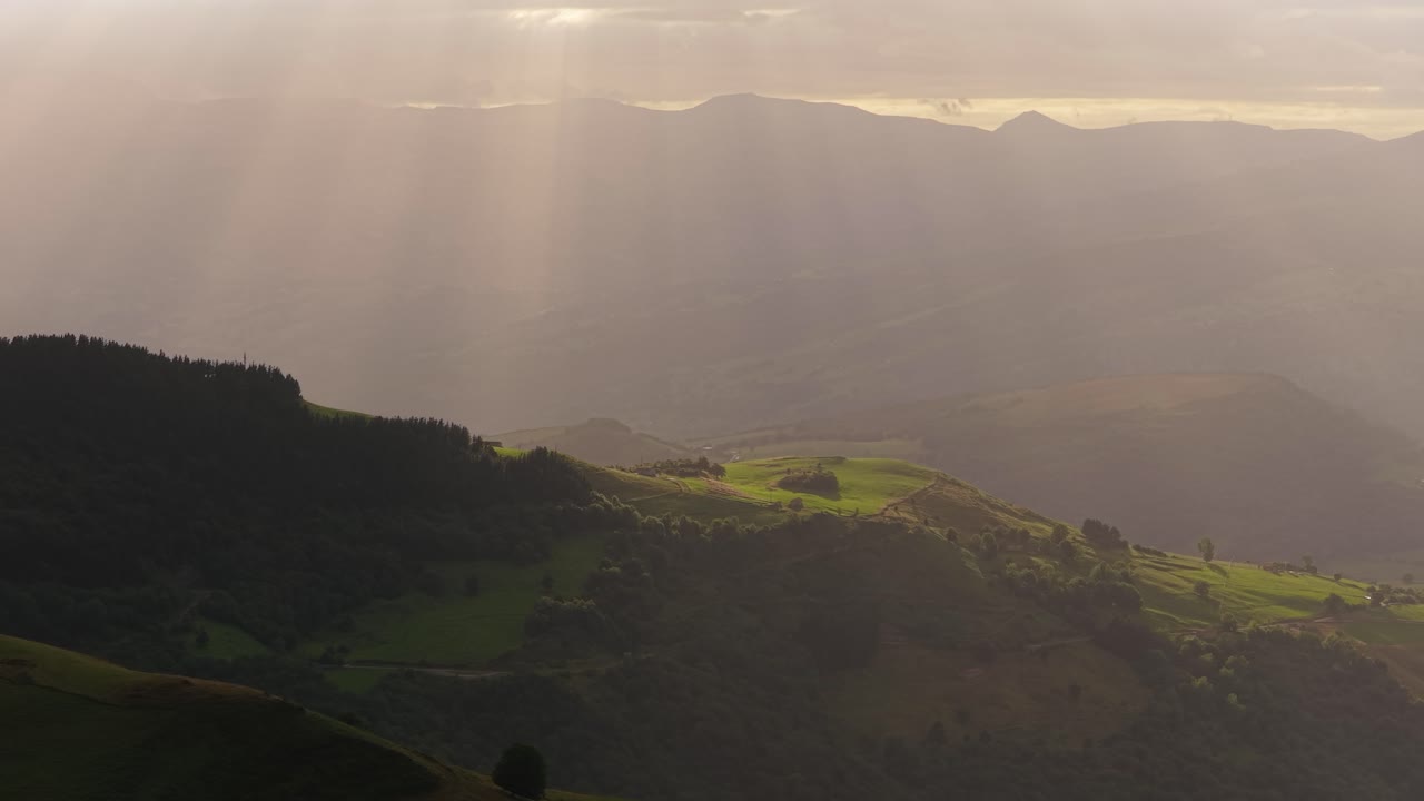 Sunbeams illuminating cantabrian valleys at sunset