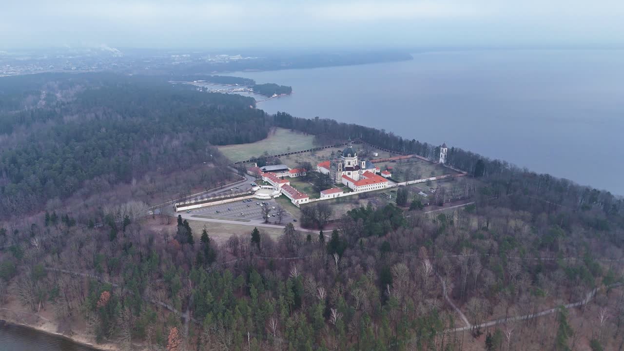 Lakeside monastery of Pazaislis under a layer of fog. Aerial view