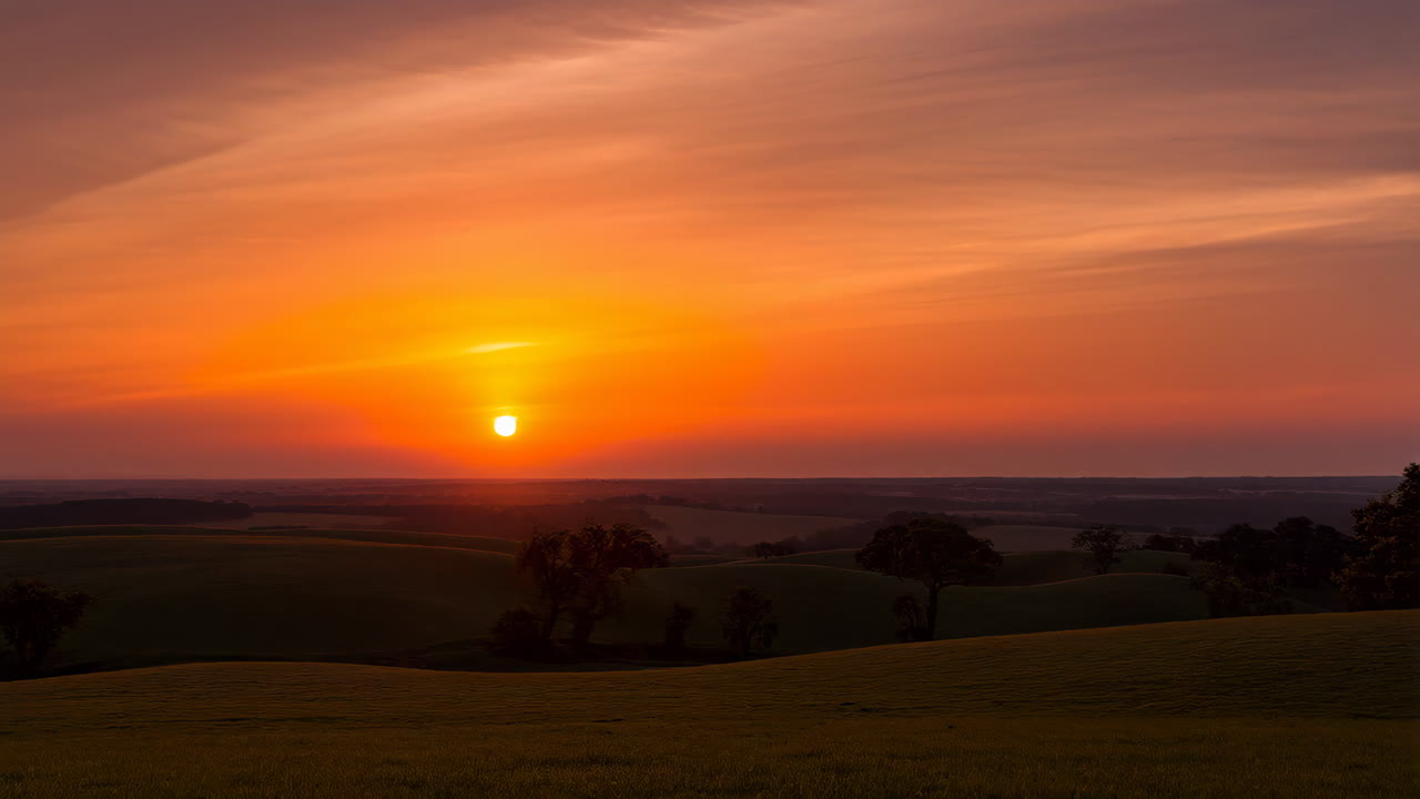 Vibrant Sunset Over Rolling Hills